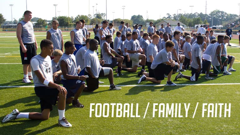 Campers taking a knee on the field at an O-D camp